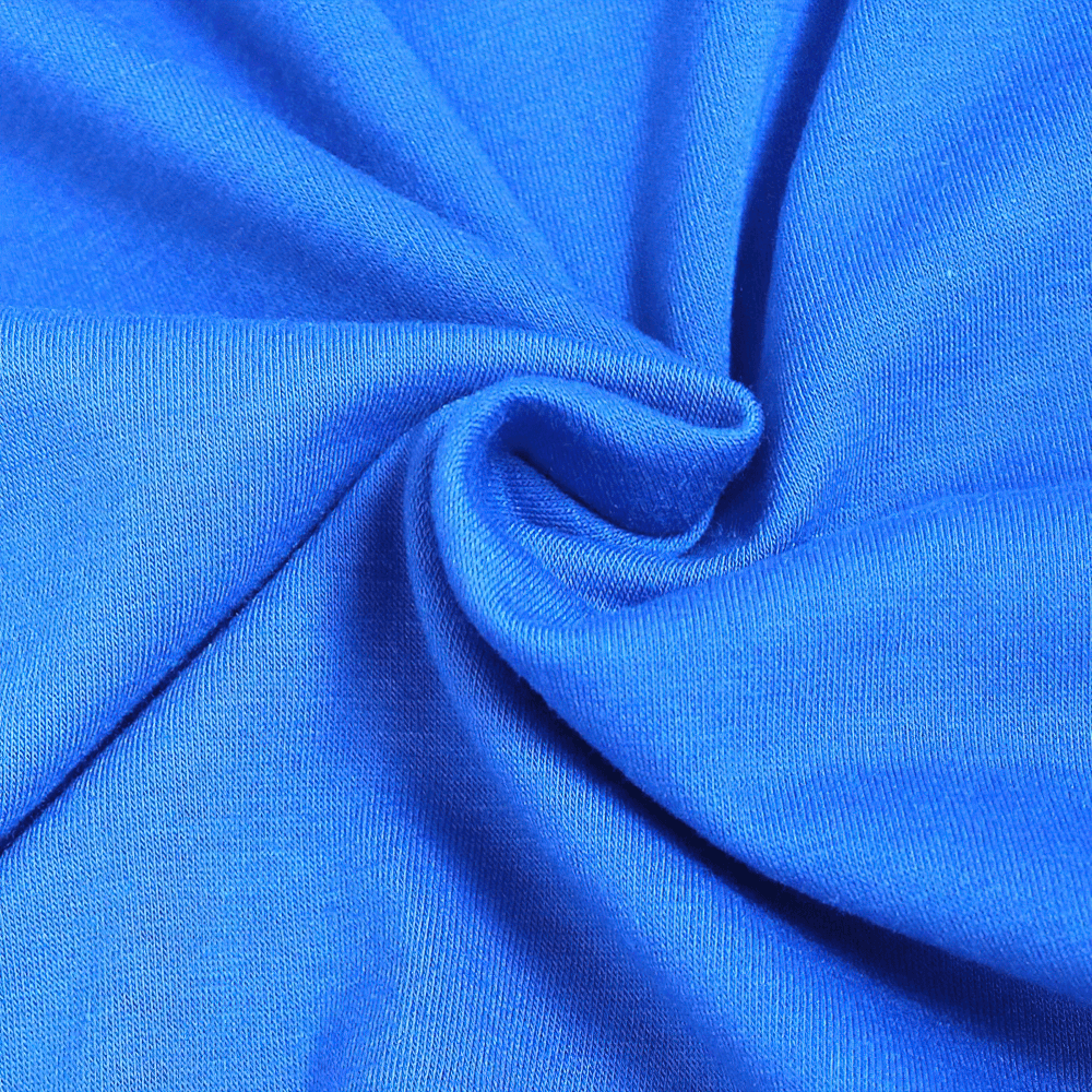Close-up of vibrant blue cotton fabric with swirling detail, ideal for kids' sports T-shirts.